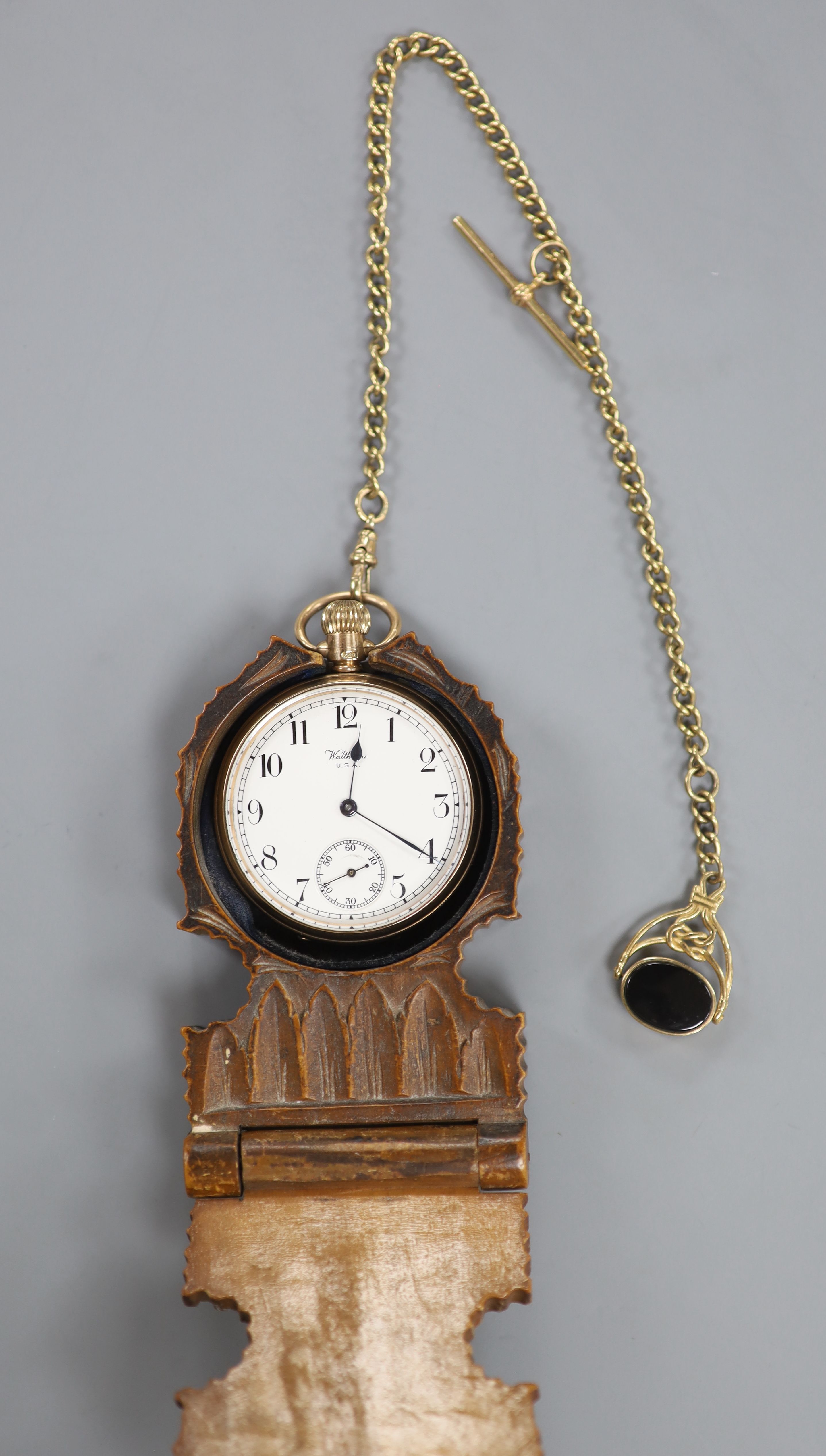 A Waltham 9ct gold keyless open face pocket watch on 9ct gold chain with swivel fob seal